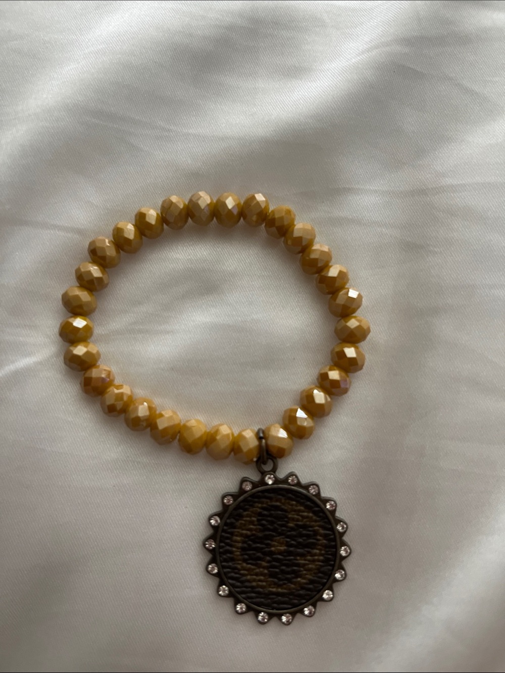 Yellow Faceted Beaded Bracelet with Round Pendant